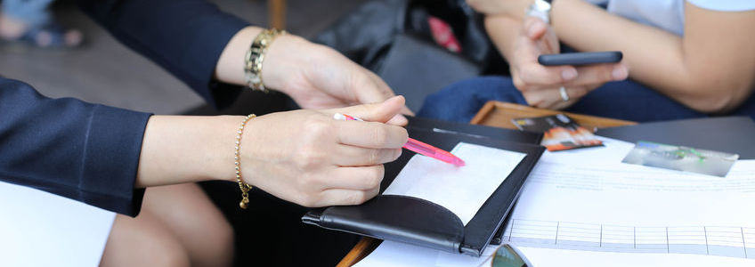 Woman and Man debating on credit card charge on a receipt